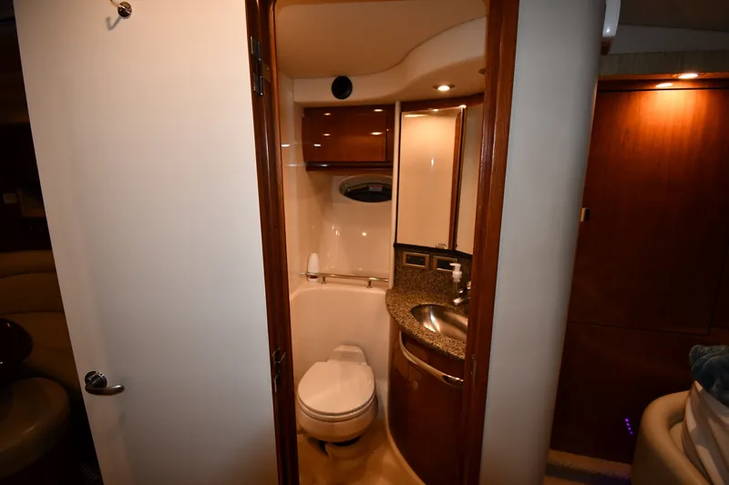 Slide: The Image of Interior of 2005 Sea Ray 420 Sundancer yacht bathroom with sink and toilet. - 26