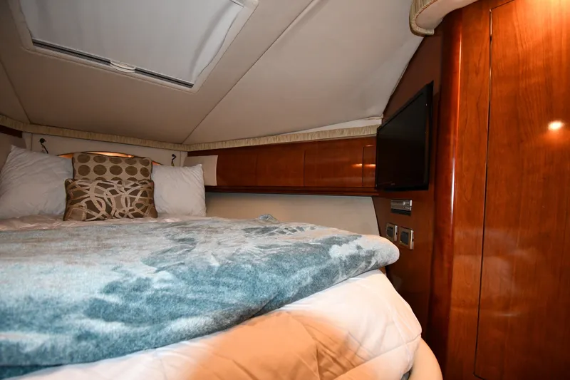 Slide: The Image of Luxurious cabin interior of 2005 Sea Ray 420 Sundancer yacht with cozy bedding. - 21