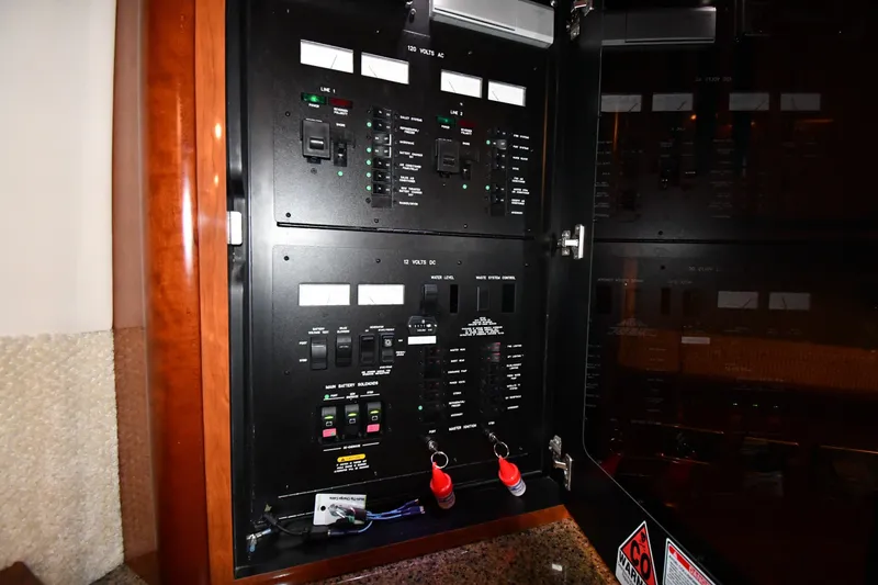Slide: The Image of Electrical control panel inside a 2005 Sea Ray 420 Sundancer yacht. - 42