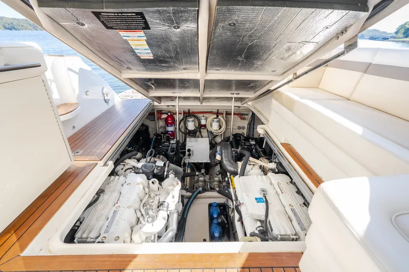 Slide: The Image of Engine compartment of a 2012 Sea Ray 450 Sundancer yacht, showcasing dual engines. - 60