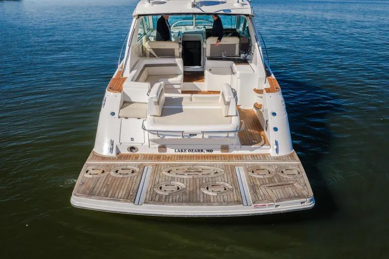 Slide: The Image of 2012 Sea Ray 450 Sundancer yacht on water, rear view, Lake Ozark, MO. - 10