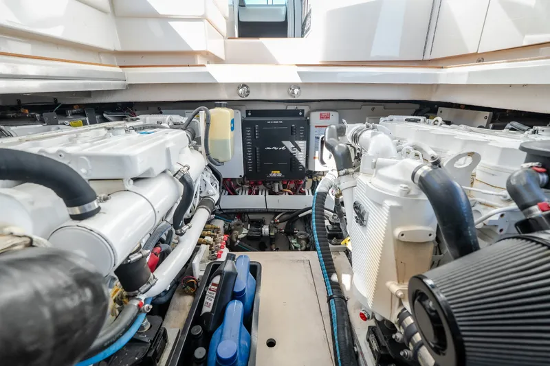 Slide: The Image of Engine room of a 2012 Sea Ray 450 Sundancer yacht, showcasing dual engines. - 61