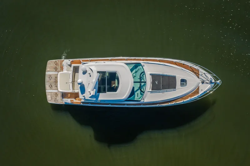 Slide: The Image of Top view of 2012 Sea Ray 450 Sundancer yacht on calm water. - 8