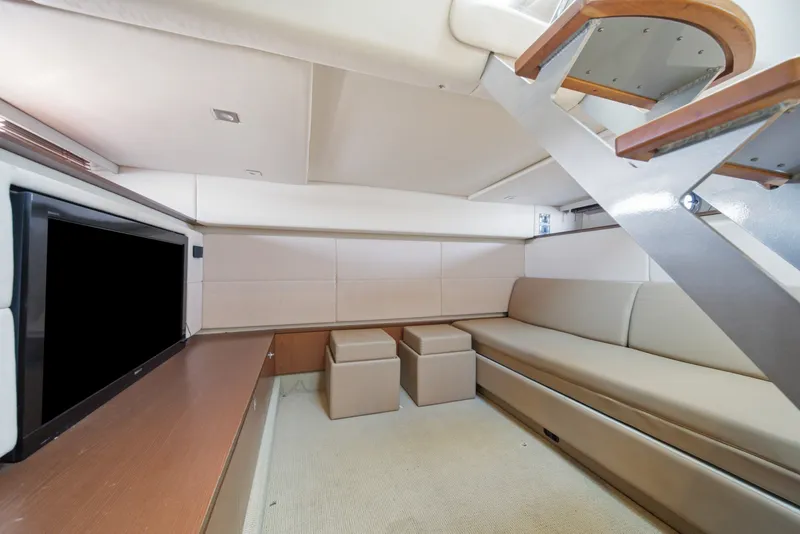 Slide: The Image of Luxurious interior of 2012 Sea Ray 450 Sundancer yacht with modern seating and TV. - 34