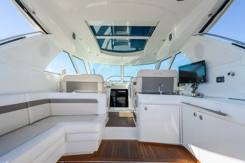 Slide: The Image of Luxurious interior of 2012 Sea Ray 450 Sundancer yacht with seating and entertainment area. - 21