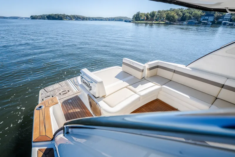 Slide: The Image of Luxurious 2012 Sea Ray 450 Sundancer yacht with spacious deck on serene water. - 18