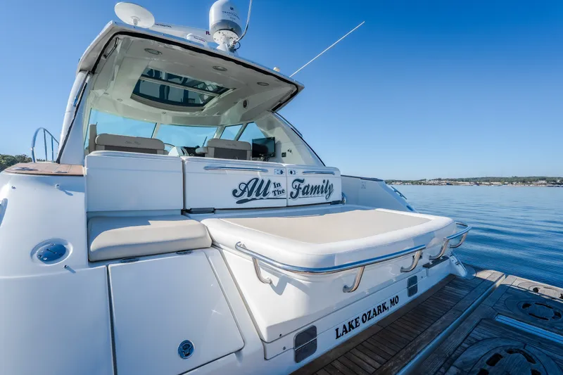 Slide: The Image of 2012 Sea Ray 450 Sundancer yacht docked at Lake Ozark, MO, under clear blue skies. - 17