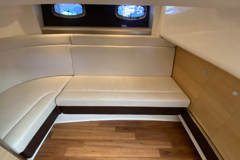 Slide: The Image of 2012 Chaparral 327 SSX interior with cream seating and wooden flooring. - 39