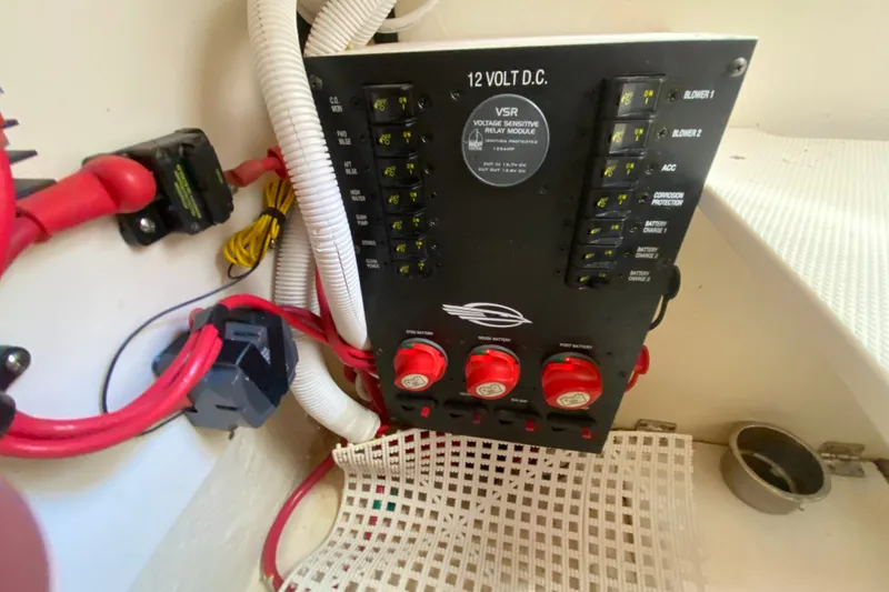 Slide: The Image of Electrical panel of a 2012 Chaparral 327 SSX boat with wiring and switches. - 18