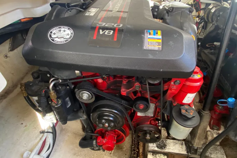 Slide: The Image of Engine of a 2012 Chaparral 327 SSX boat, featuring a 320 V8 motor. - 32