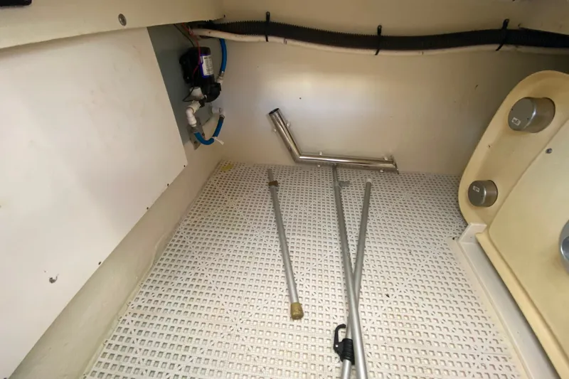 Slide: The Image of Interior view of 2012 Chaparral 327 SSX boat compartment with equipment and storage. - 17