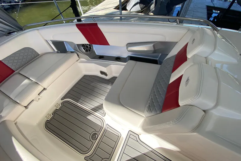 Slide: The Image of Luxurious seating area on a 2012 Chaparral 327 SSX boat with red accents. - 15