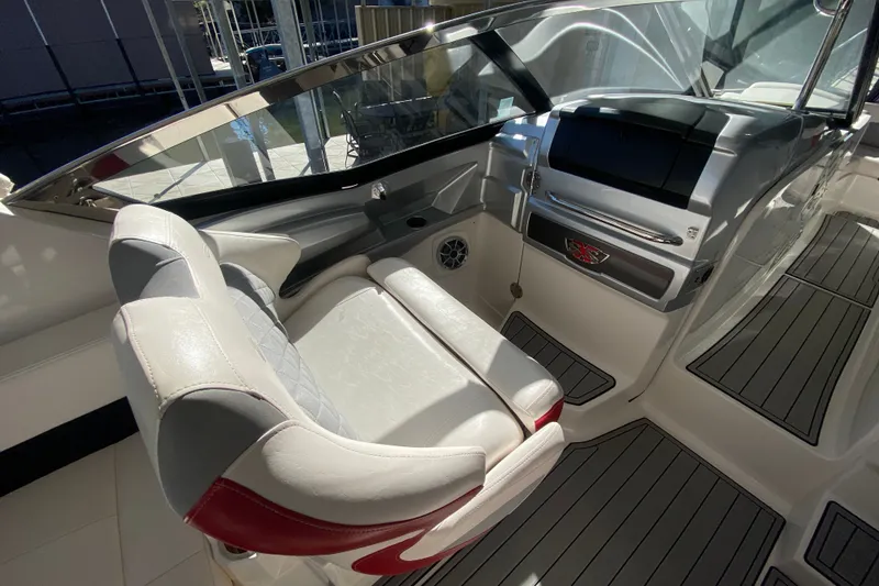 Slide: The Image of Interior of 2012 Chaparral 327 SSX boat with sleek seating and modern dashboard. - 24