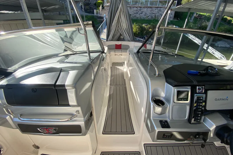 Slide: The Image of 2012 Chaparral 327 SSX boat interior with Garmin navigation system and sleek design. - 28