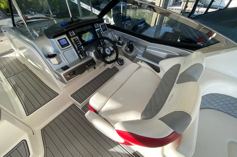 Slide: The Image of Interior of 2012 Chaparral 327 SSX boat with modern dashboard and comfortable seating. - 25