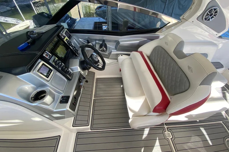Slide: The Image of Interior of 2012 Chaparral 327 SSX boat with modern dashboard and seating. - 26