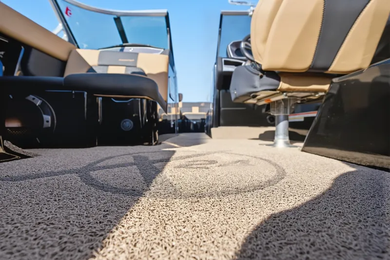 Slide: The Image of Interior view of 2020 MasterCraft X24 boat with tan and black seating. - 25