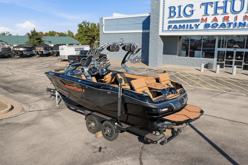 Slide: The Image of 2020 MasterCraft X24 boat on trailer at Big Thunder Marine dealership. - 15