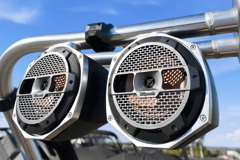 Slide: The Image of Klipsch speakers mounted on a 2020 MasterCraft X24 boat, under a clear blue sky. - 40