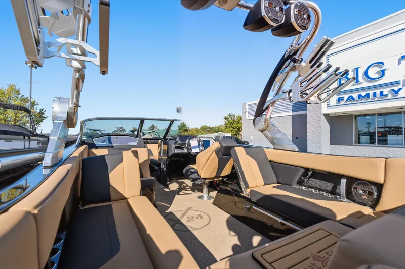 Slide: The Image of 2020 MasterCraft X24 boat interior with tan seating and advanced audio system. - 23