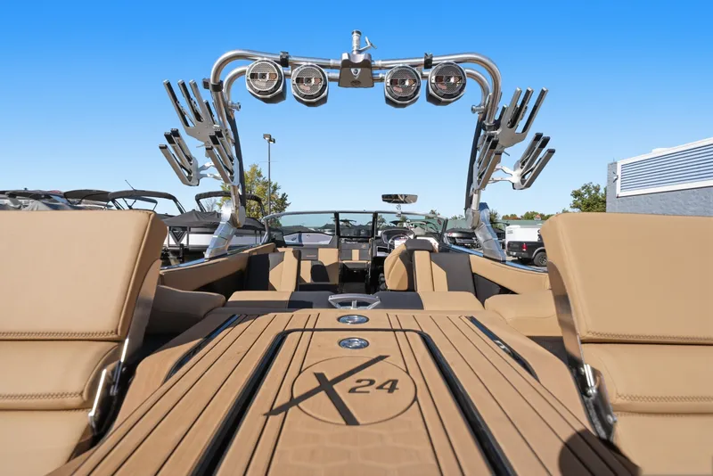 Slide: The Image of 2020 MasterCraft X24 boat interior with tan seating and advanced audio system. - 22