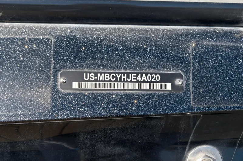 Slide: The Image of 2020 MasterCraft X24 boat hull identification number with barcode on a speckled surface. - 19