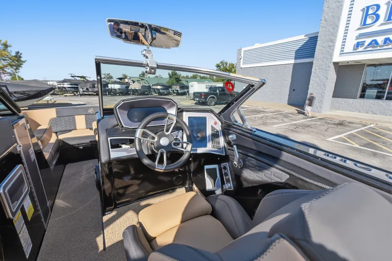 Slide: The Image of 2020 MasterCraft X24 boat interior with modern dashboard and steering wheel. - 26