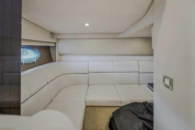 Slide: The Image of Interior of 2017 Formula 37 Performance Cruiser with white leather seating and porthole window. - 49