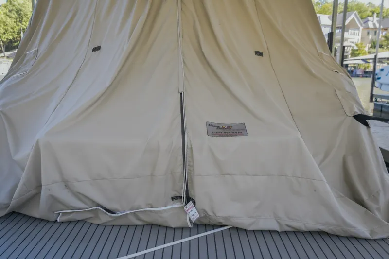 Slide: The Image of Covered 2017 Formula 37 Performance Cruiser on dock, beige protective cover. - 74