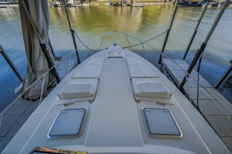 Slide: The Image of 2017 Formula 37 Performance Cruiser docked, showcasing spacious deck and sleek design. - 39