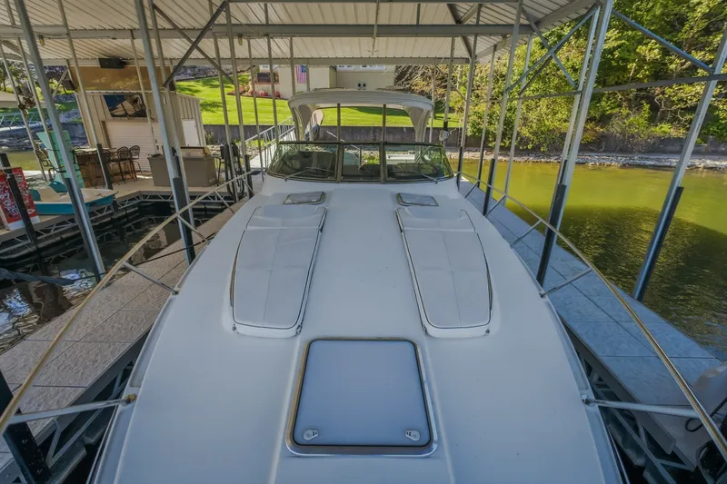 Slide: The Image of 2017 Formula 37 Performance Cruiser docked under a covered marina. - 45