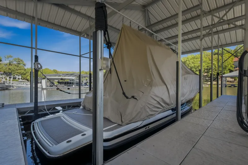 Slide: The Image of Covered 2017 Formula 37 Performance Cruiser docked under a metal canopy. - 73