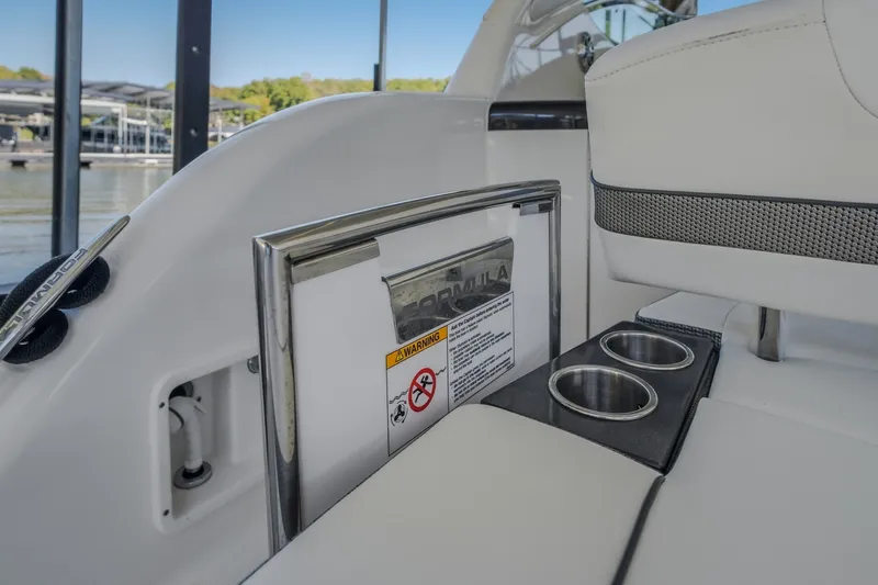 Slide: The Image of 2017 Formula 37 Performance Cruiser interior with cup holders and sleek design. - 22
