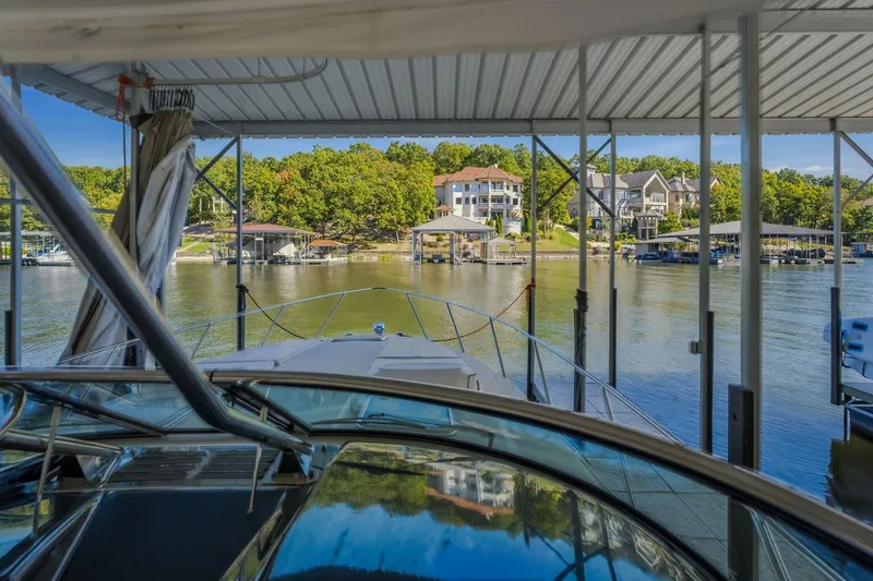 Slide: The Image of 2017 Formula 37 Performance Cruiser docked at a scenic lakeside marina. - 32
