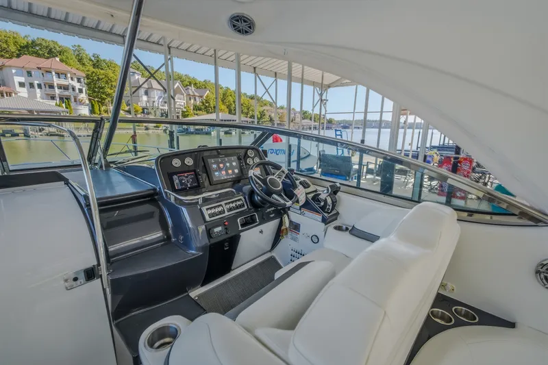 Slide: The Image of 2017 Formula 37 Performance Cruiser cockpit with modern controls and white seating. - 24