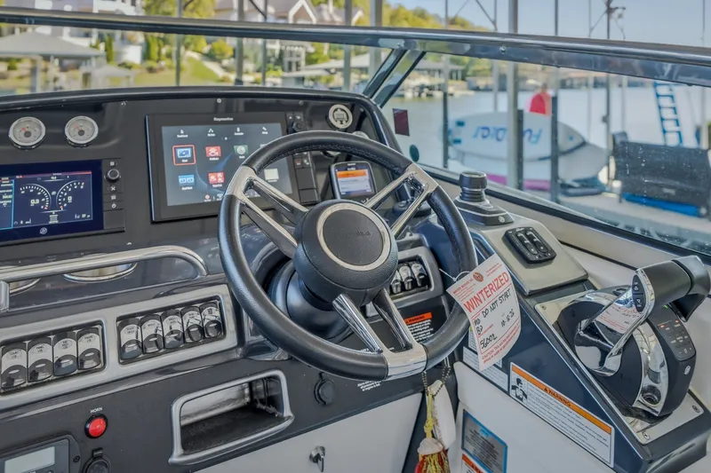 Slide: The Image of Cockpit of 2017 Formula 37 Performance Cruiser with advanced navigation controls and steering wheel. - 25