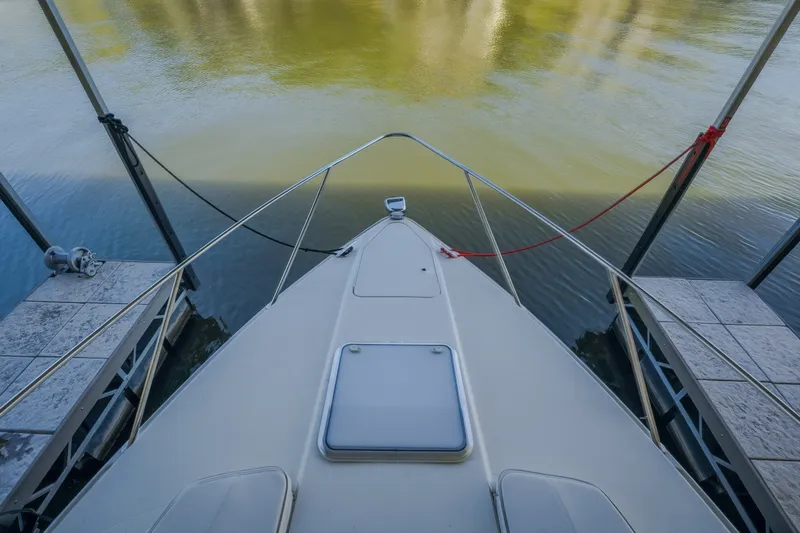Slide: The Image of Bow view of 2017 Formula 37 Performance Cruiser docked on calm water. - 44