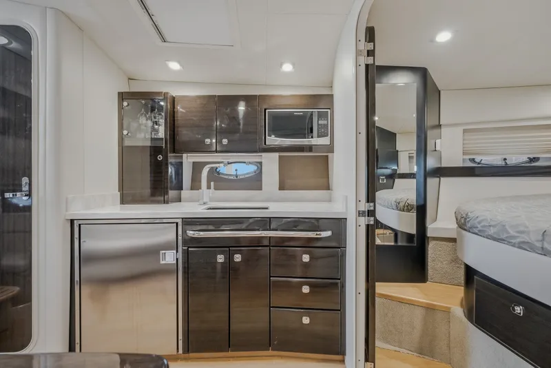 Slide: The Image of Interior of 2017 Formula 37 Performance Cruiser with modern kitchen and cozy sleeping area. - 61