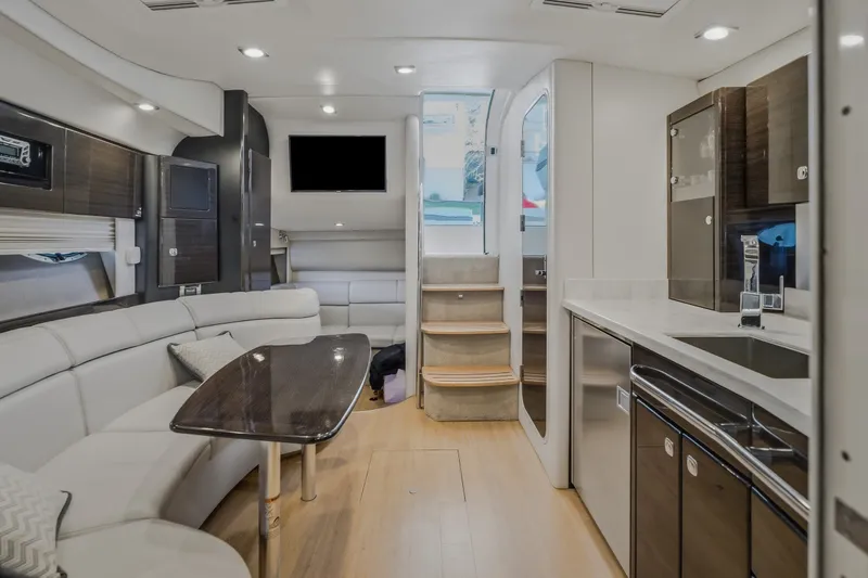 Slide: The Image of Luxurious interior of 2017 Formula 37 Performance Cruiser with modern kitchen and seating area. - 56
