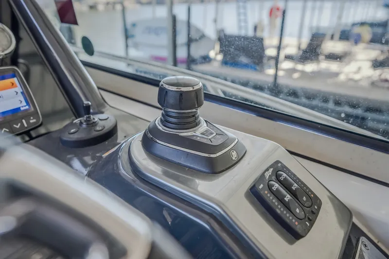 Slide: The Image of Control panel of a 2017 Formula 37 Performance Cruiser boat, featuring joystick and buttons. - 29