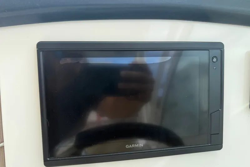 Slide: The Image of Garmin display on 2019 Sailfish 245 DC boat dashboard. - 18