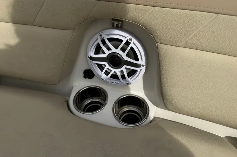 Slide: The Image of Speaker and cup holders on 2019 Sailfish 245 DC boat interior. - 13