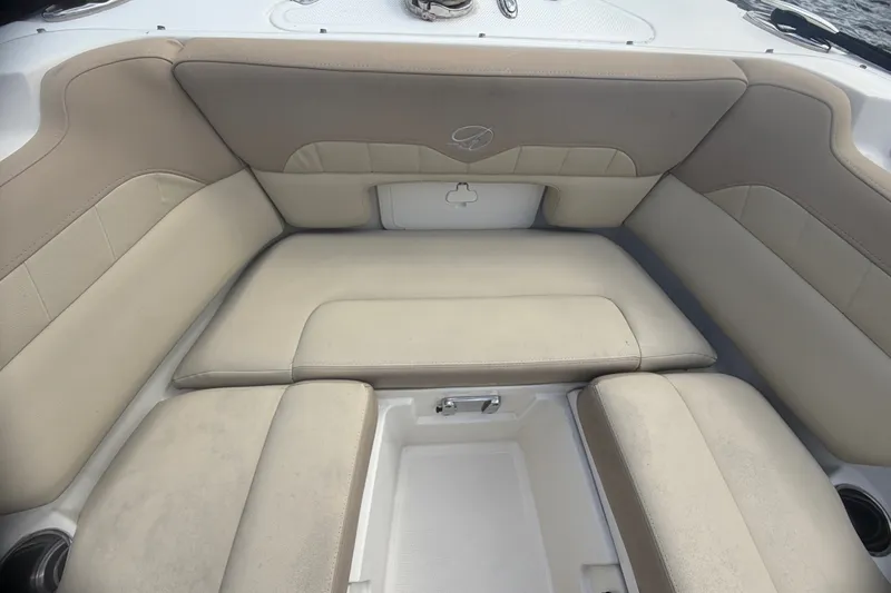 Slide: The Image of 2019 Sailfish 245 DC boat interior with beige cushioned seating. - 41