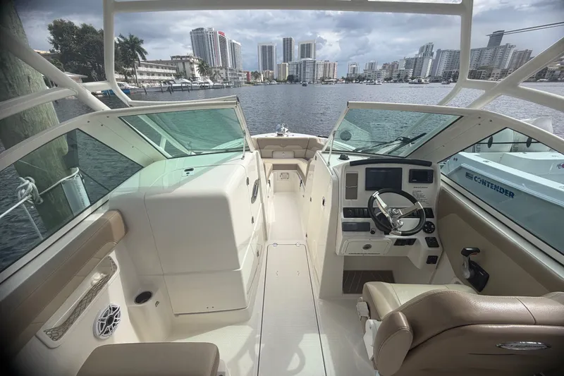 Slide: The Image of 2019 Sailfish 245 DC boat interior with city skyline in the background. - 23