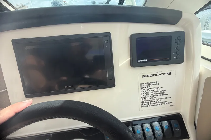 Slide: The Image of Dashboard of 2019 Sailfish 245 DC boat with Garmin and Yamaha displays. - 45