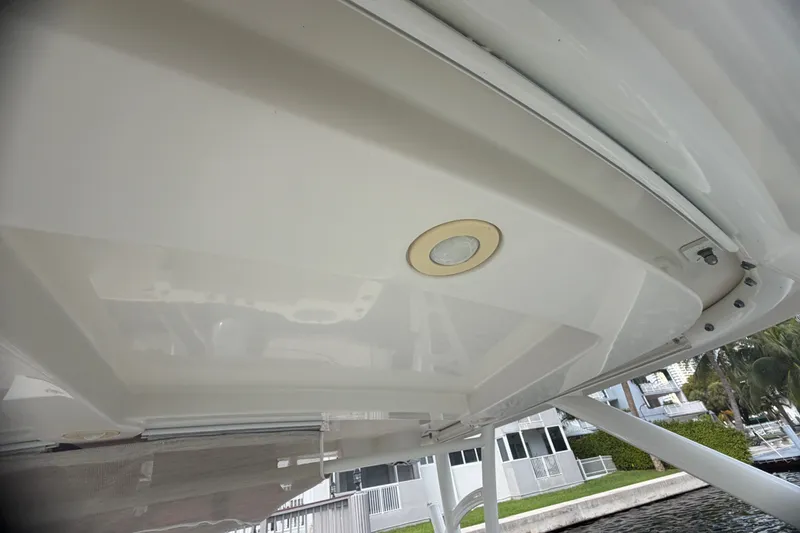 Slide: The Image of 2019 Sailfish 245 DC boat ceiling with recessed light, dockside view. - 43