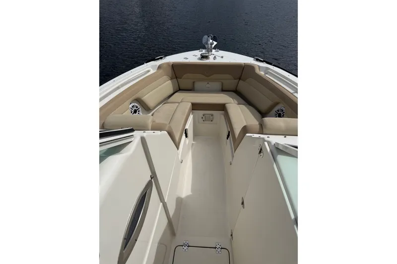 Slide: The Image of Spacious interior of 2019 Sailfish 245 DC boat with beige seating. - 8