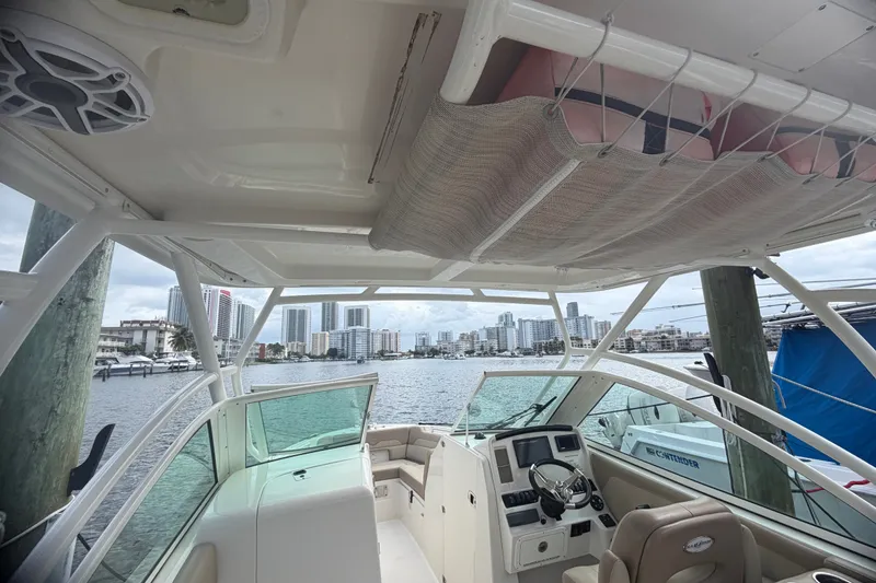 Slide: The Image of Interior view of a 2019 Sailfish 245 DC boat docked in a marina. - 39