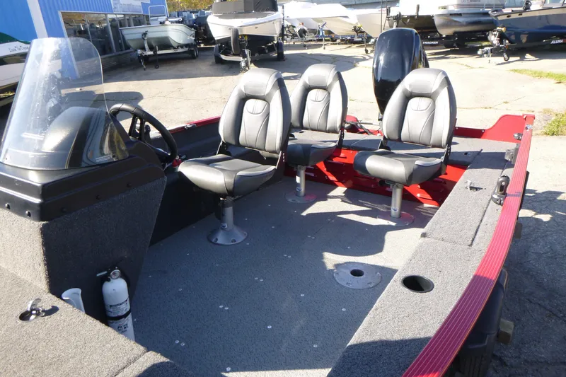 Slide: The Image of 2022 Lund 1650 Angler SS boat interior with three seats and steering console. - 9