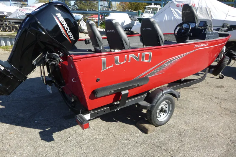 Slide: The Image of Red 2022 Lund 1650 Angler SS boat with Mercury engine on trailer. - 2
